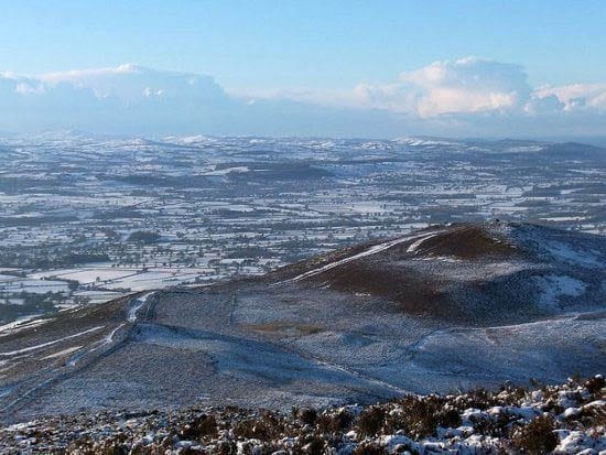 Offas dyke "Looking towards Snowdonia, with a scattering of snow"