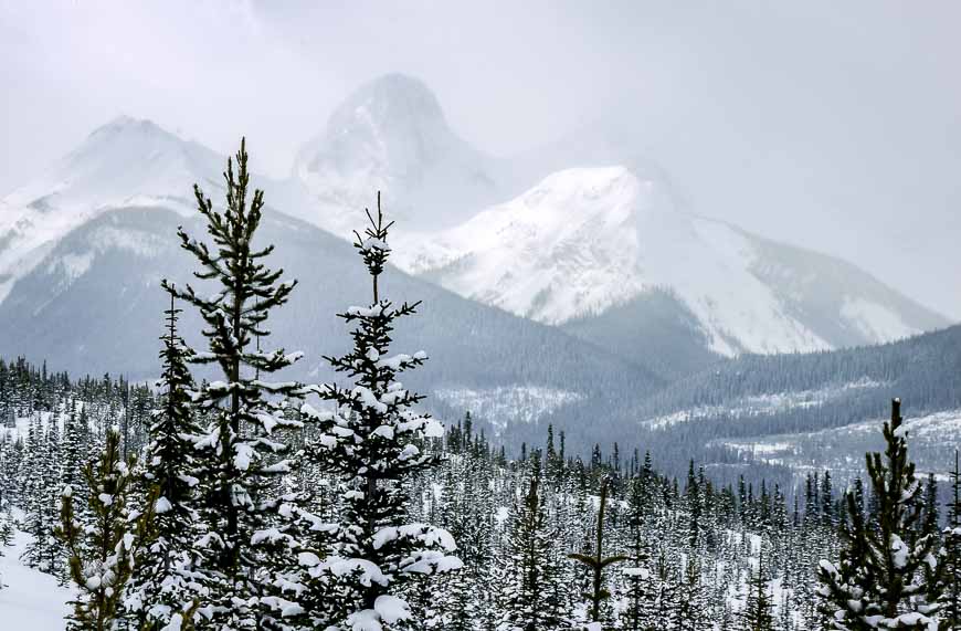 Snowshoeing to mountain lakes and enjoying peek a boo views of the mountains