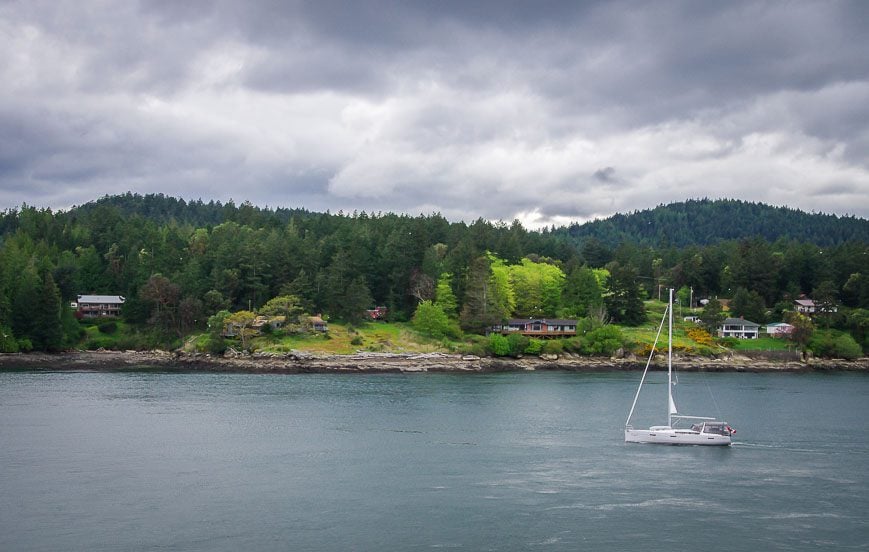 Looking out to a passing sailboat and Galiano Island