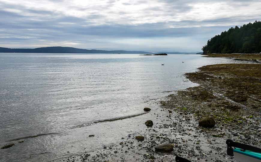 Kayaking to Valdes Island and landing at Blackberry Point under cloudy skies