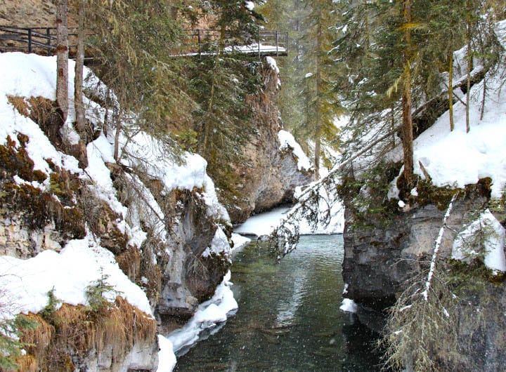 river running through a canyon covered in snow