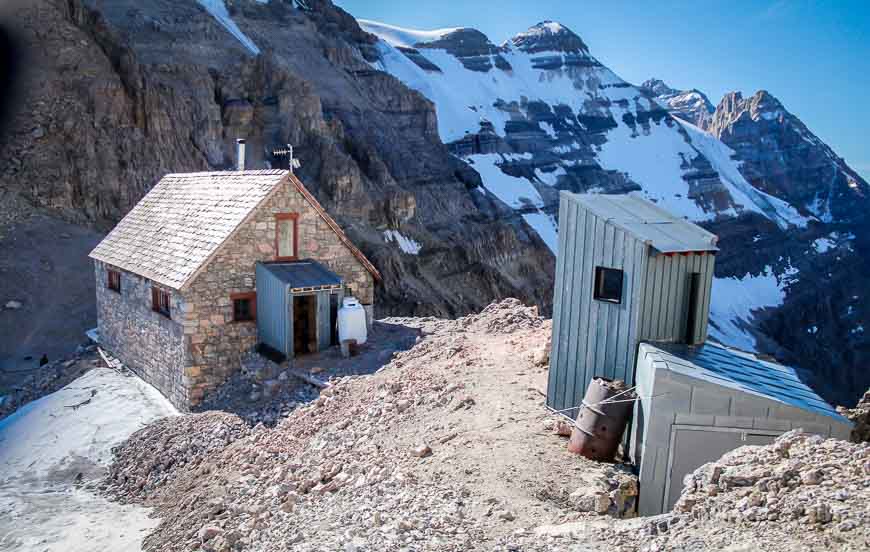 Back view of the hut and the outhouse with a view