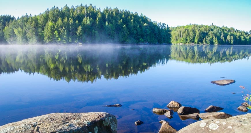 Canoeing in Algonquin Park means you can enjoy morning mist on the lake