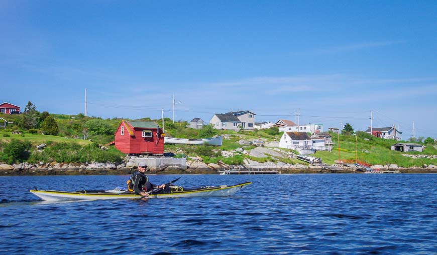 The trip kayaking Peggys Cove starts by heading past the colourful homes in West Dover