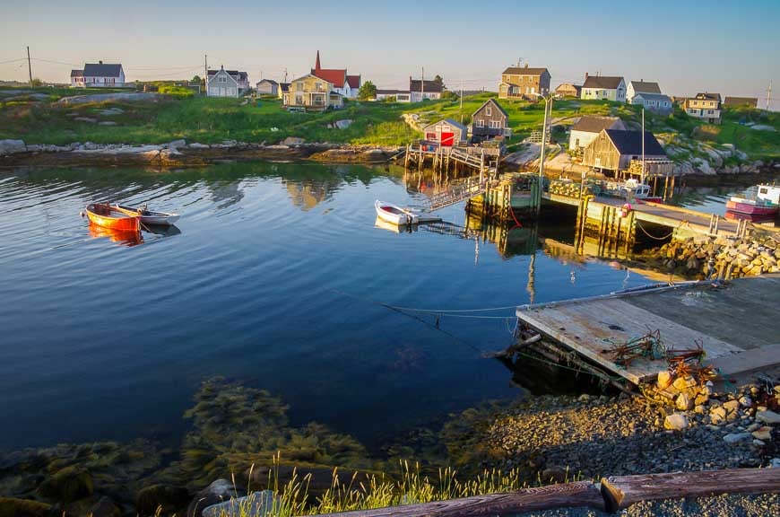 Cycling Nova Scotia past the colourful harbour in Peggy's Cove