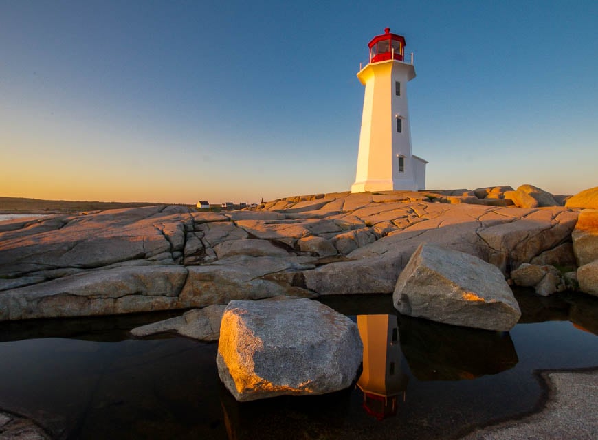 Beautiful lighthouse reflection in Peggy's Cove - one of the must see sights in Canada in summer if you're in Nova Scotia