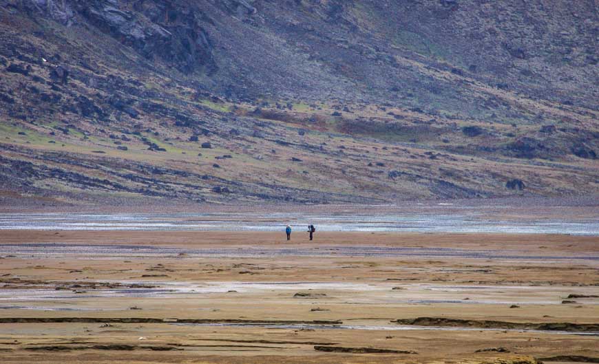 Hikers looking for a way across the river