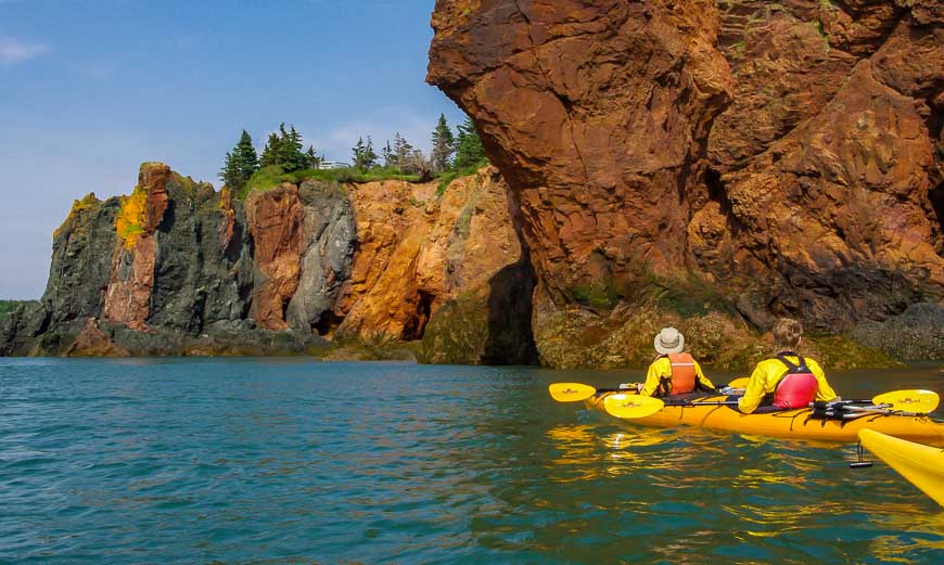 Adventures in Nova Scotia include kayaking the Bay of Fundy past incredibly coloured rock outcrop