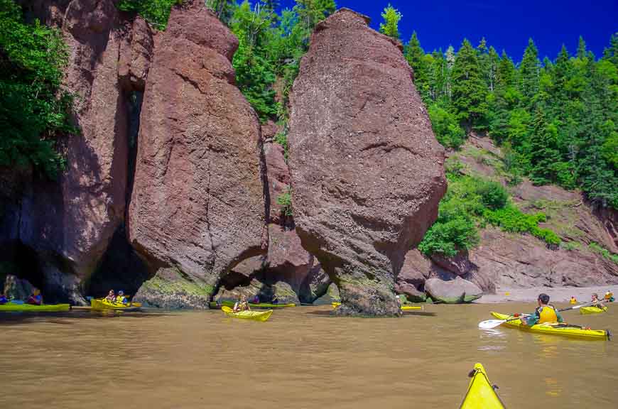 Kayaking in between the rock formations - one of the fun places to visit in New Brunswick