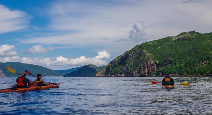 Clouds are building by 10:30 AM kayaking the Saguenay Fjord in Canada in summer