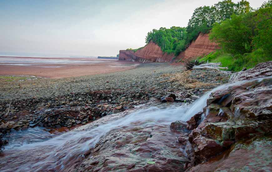 Small waterfall emptying onto Blomidon Beach