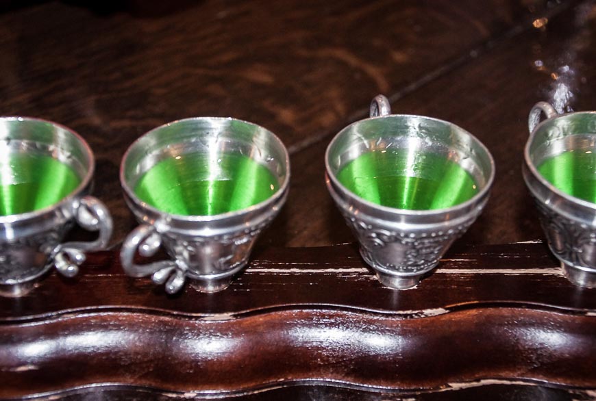 Green liquor served in a funnel you're supposed to chug 