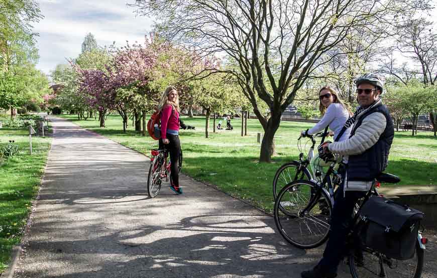 Our group cycling through a blossom filled park in Dresden