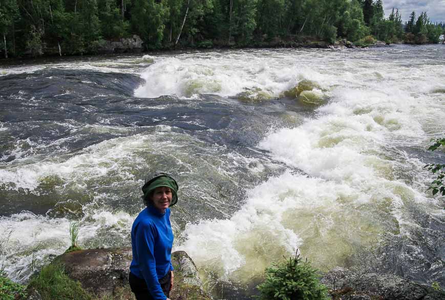 Decked out in a head net for the portage with Sluice Falls in the background