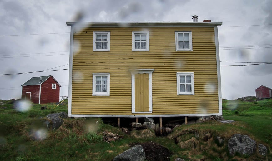 Yellow house seen through the raindrops