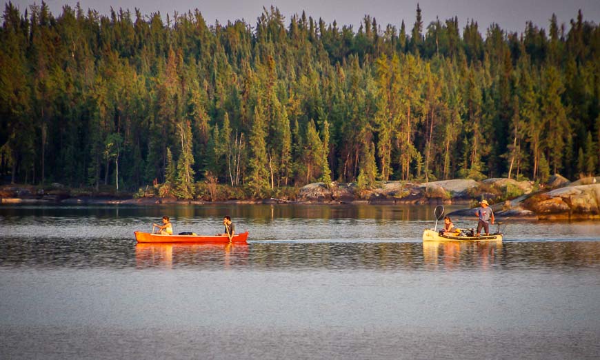 Watching as a party of two canoes paddled in on a Friday night 