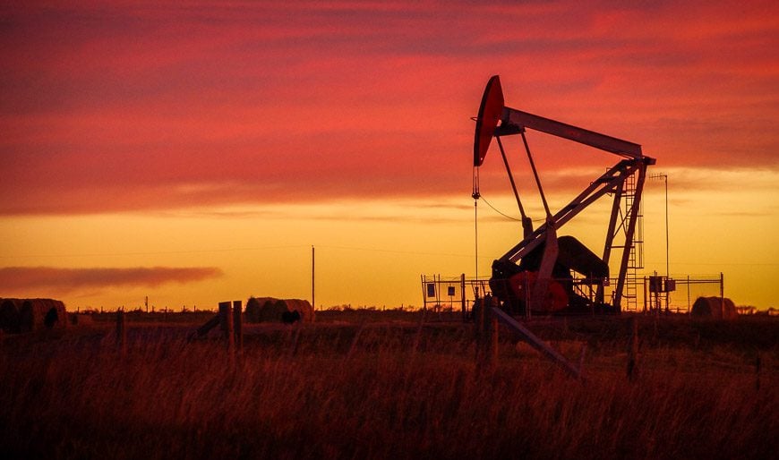 Oil well at sunrise along the Cowboy Trail