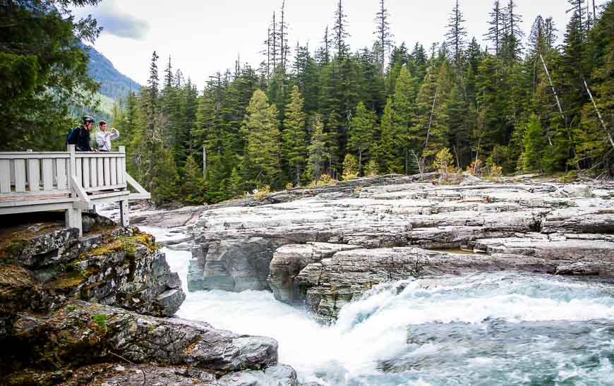 Admiring the falls above Lake McDonald