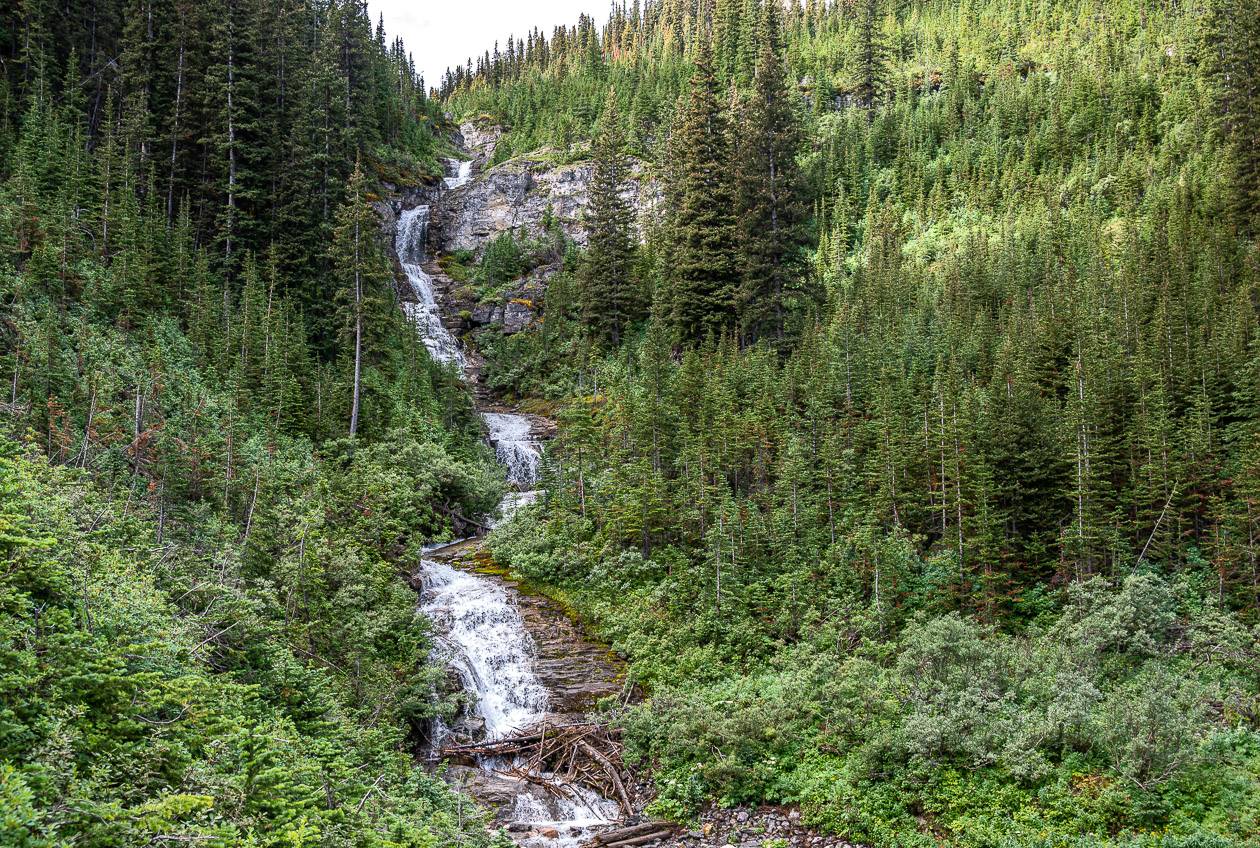 The bottom of a a sizable waterfall is a great place to cool the feet at the end of a hot hike