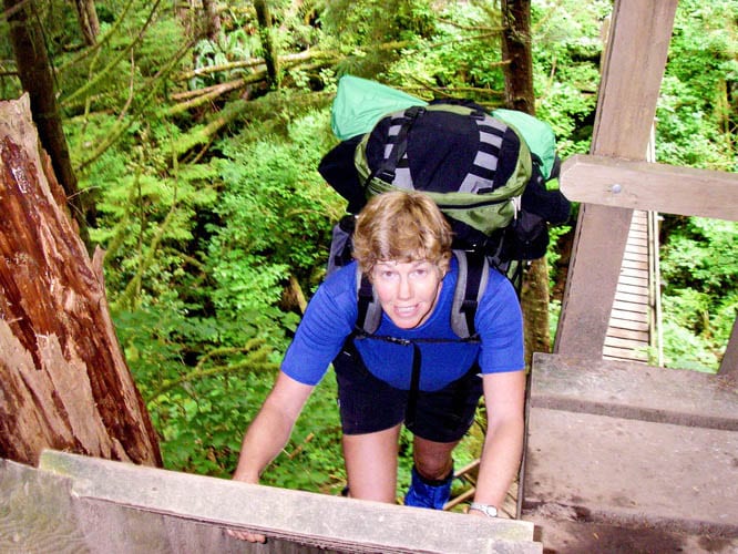 Climbing one of the many ladders on the West Coast Trail - tops for scenic backpacking trips in Canada
