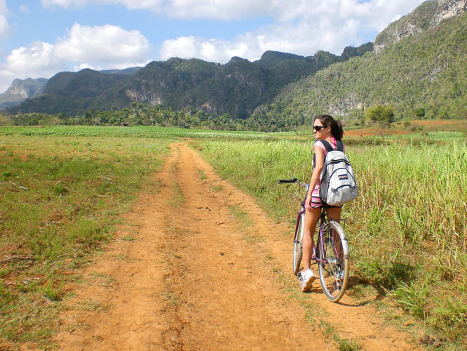Biking the red roads in Parque Nacional Vinales in Cuba