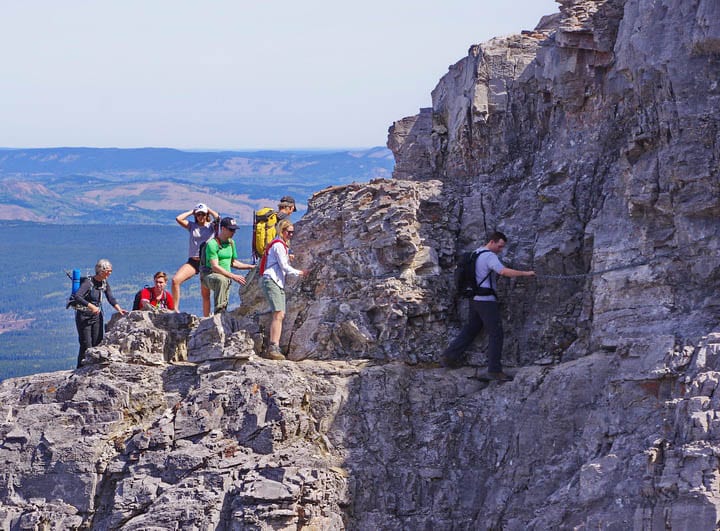 A line-up for the chain section on Mt Yamnuska