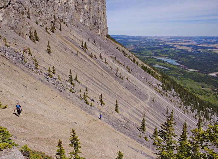 Crossing the scree slopes beneath the summit of Yamnuska