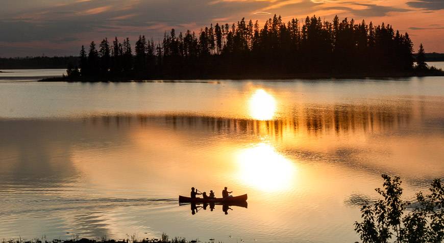 Peaceful evening canoeing on Astotin Lake