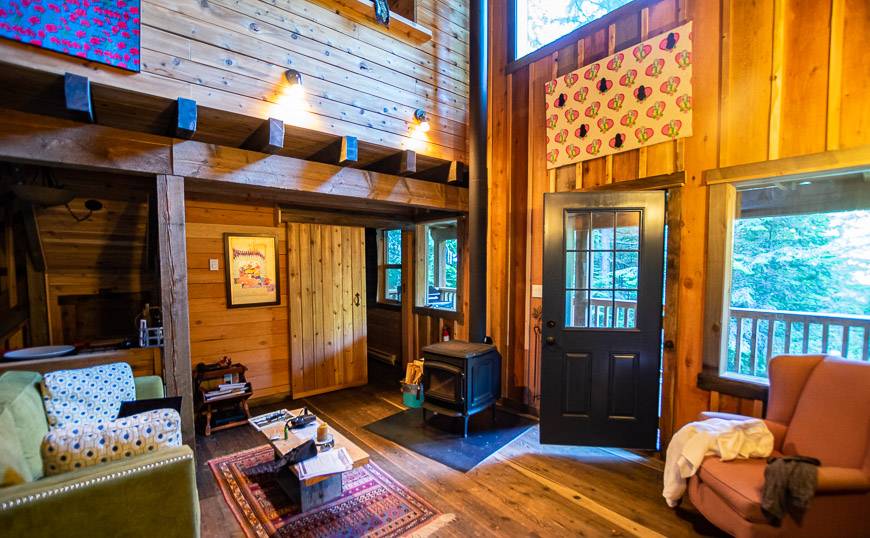 The main floor sitting area in one of the Logden Lodge cabins with art pieces from the owner's private collection
