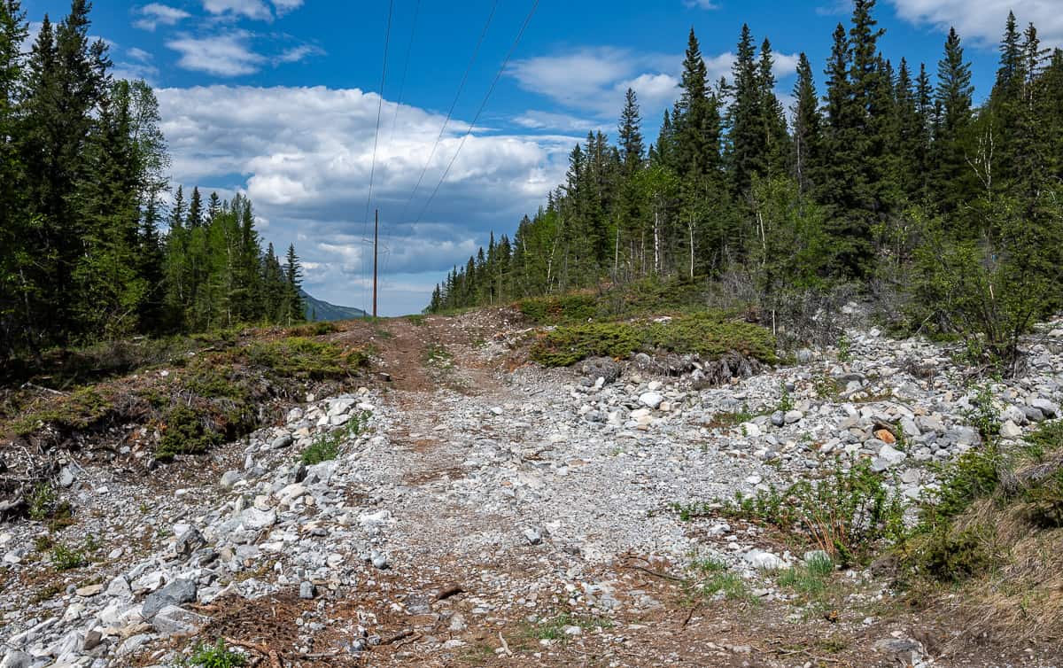 When you reach the open area with electrical poles go left towards the parking lot - 2.3 km distant