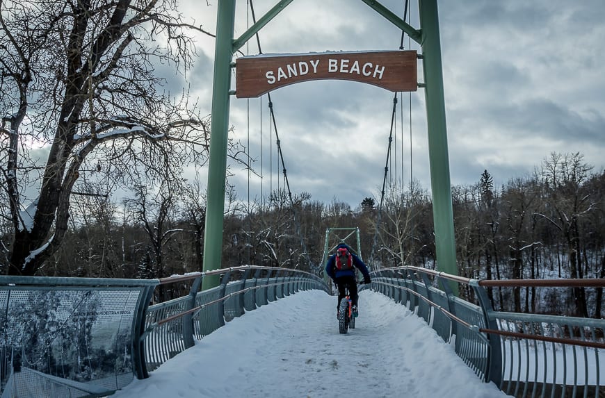 Winter fat biking in Calgary - heading across the Elbow River in Sandy Beach