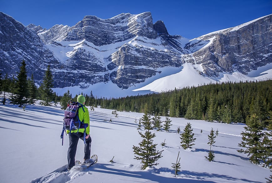  Snowshoeing with a backdrop of Fortress Mountain and the Headwall