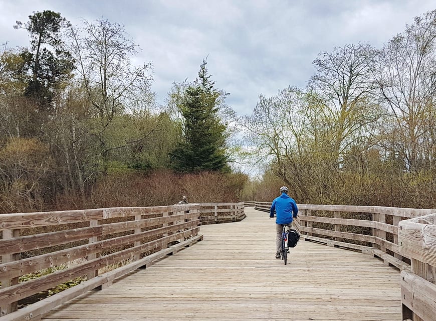 Cycling in Victoria BC across the Swan Trestle on the Lochside Trail