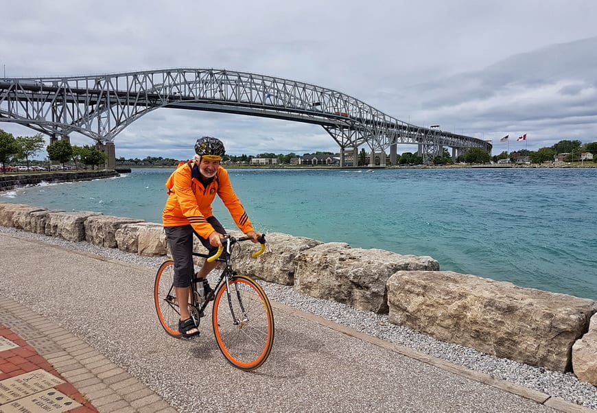 Cycling in view of the Blue Water Bridge joining the US and Canada