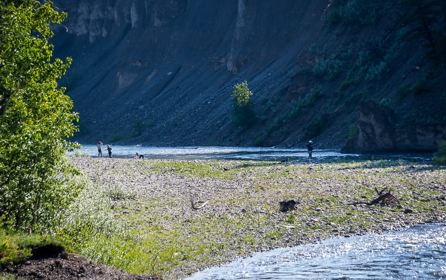  Walk down to the water's edge across from the sandstone cliffs