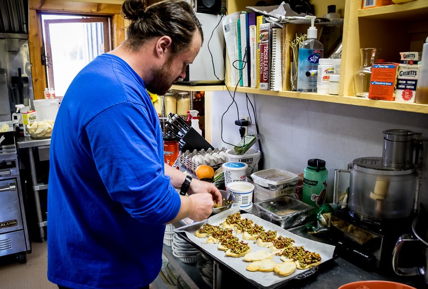 Cook whipping up some vegan tapenade at Purcell Mountain Lodge