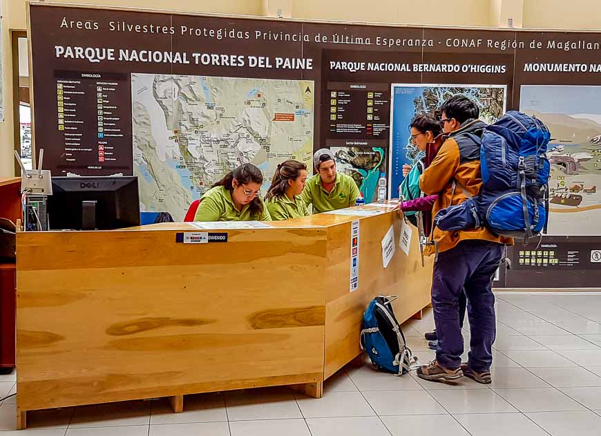 Buying a park pass for the Torres del Paine trek at the CONAF kisok in the bus station in Puerto Natales