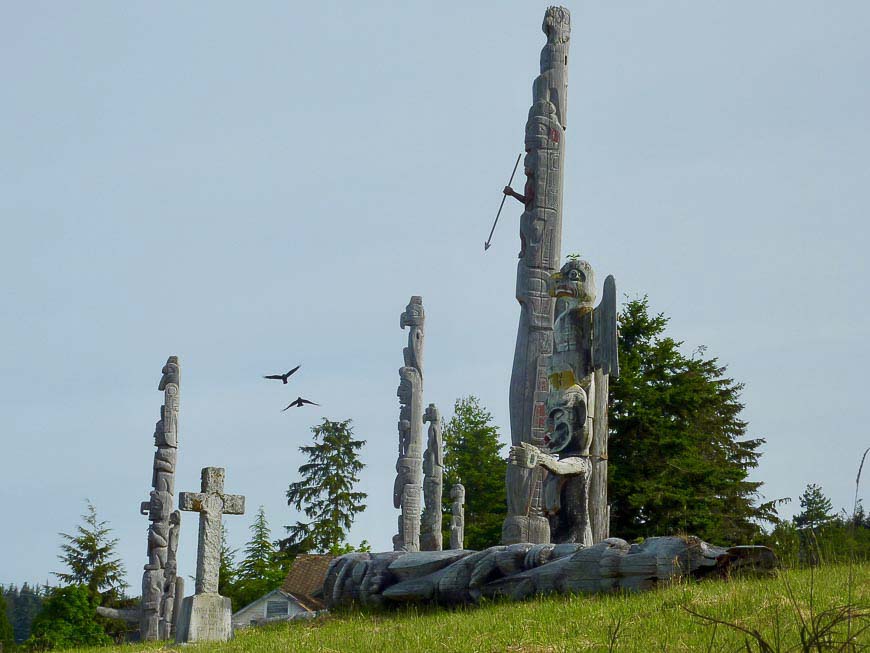 Namgis Burial Ground, Alert Bay. Totem poles and Christian crosses. Fallen poles are left where they lie, marking a longer cycle of death and passage