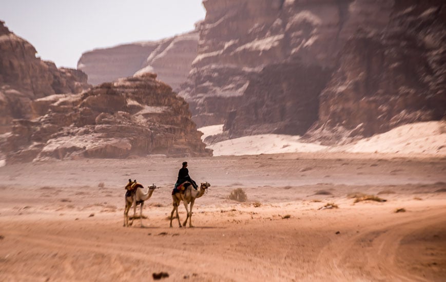 A timeless photo of a man on a camel in Wadi Rum