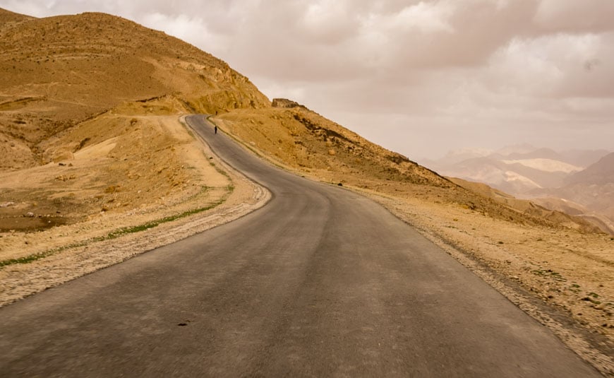 Cycling Jordan on a lonely road by several nomad camps