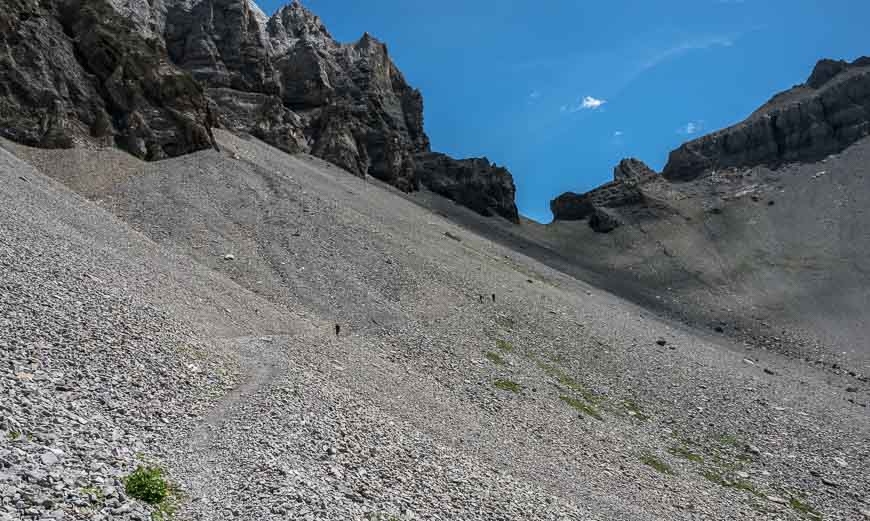 Negotiate a steep scree slope on the way to Adelboden