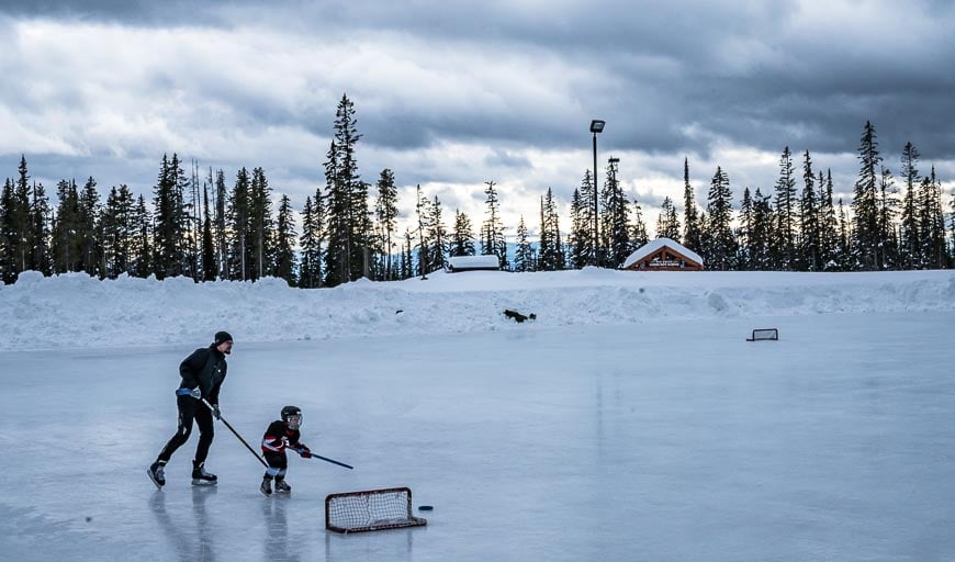 A father-son playing hockey at Big White