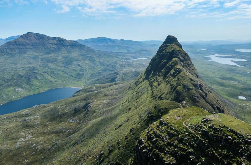 Mt. Suilven isn’t a high mountain nor is the hike long, but it’s tricky to navigate and reach in the remote, lake-strewn wilderness of Scotland. (Courtesy Visit Scotland)
