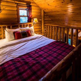 Our queen size bed upstairs in the loft at Baker Creek by Basecamp