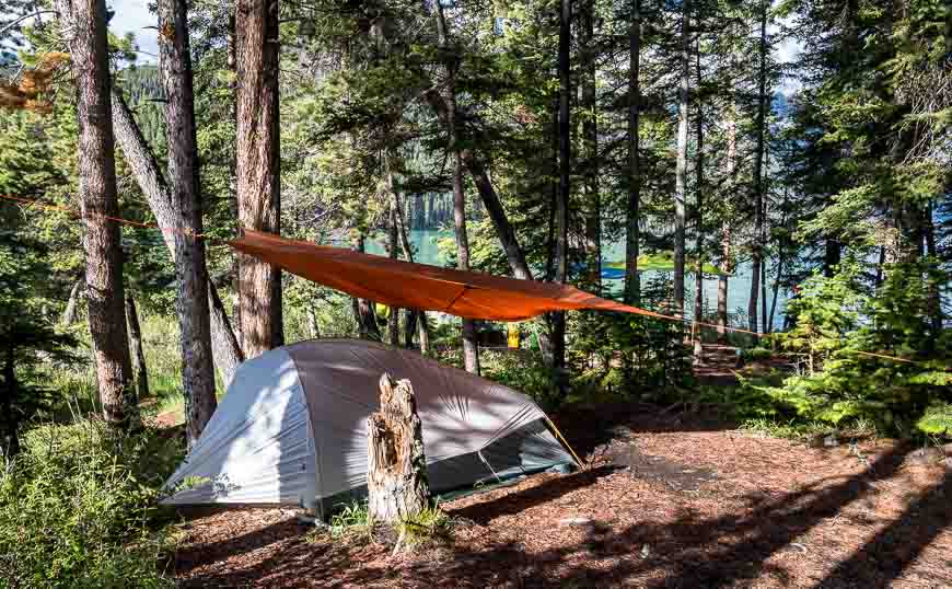 Sweet tent setup with a tarp to protect from rain