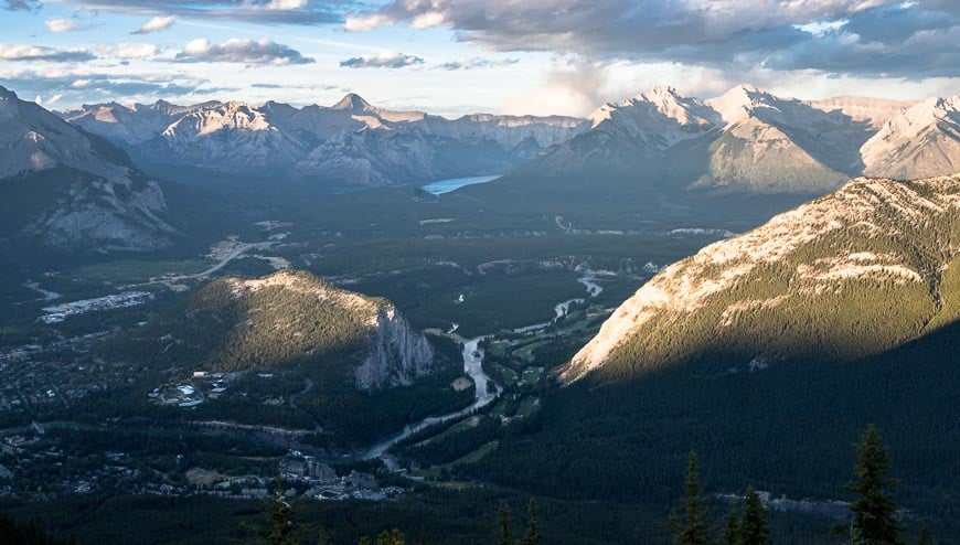 Looking out to Lake Minnewanka past the sunlit peaks of Tunnel Mountain and Mt. Rundle