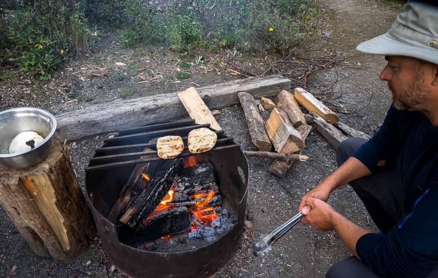 Our friend JR from Off Track Travel cooking his homemade bread over a fire
