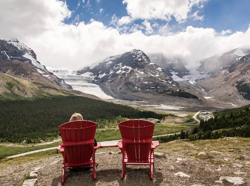 Enjoy a red chair moment and a view to the Columbia Icefields part way up Wilcox Pass