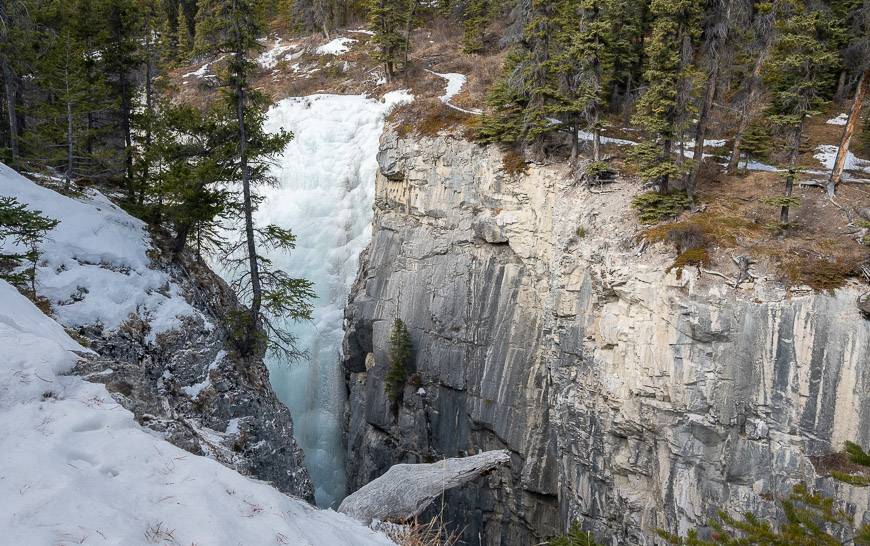 Pass a major frozen waterfall on route