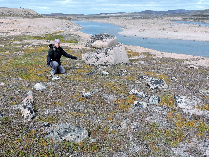 The author admires an ancient Thule tent ring Ukkusiksalik National Park. The Thules were ancestors of Canada’s Inuit. Photo credit: Marlis Butcher